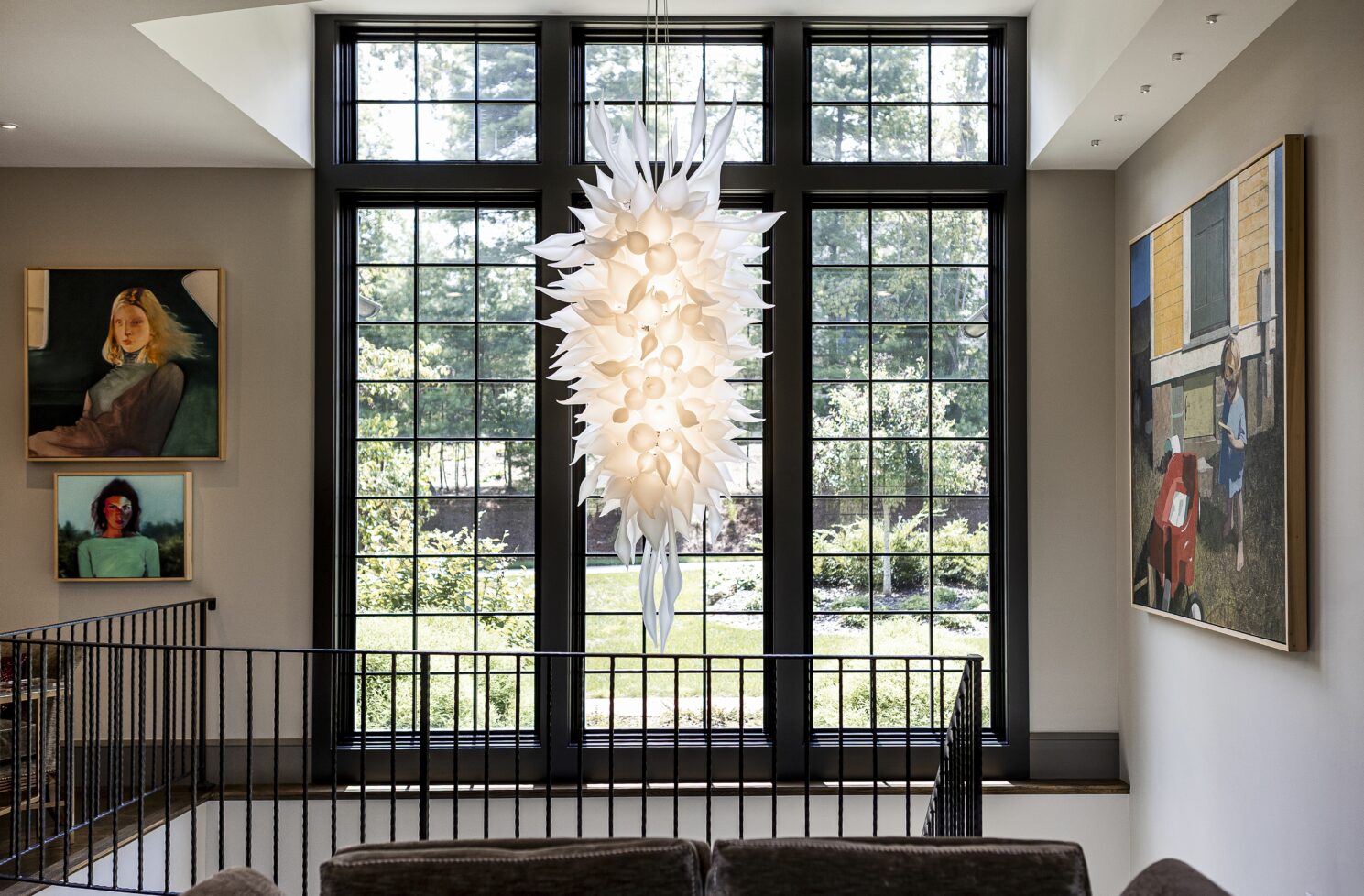 Custom chandelier by glass artist Seth Parks reflecting The Ramble Biltmore Forest’s connection to Asheville art and culture.