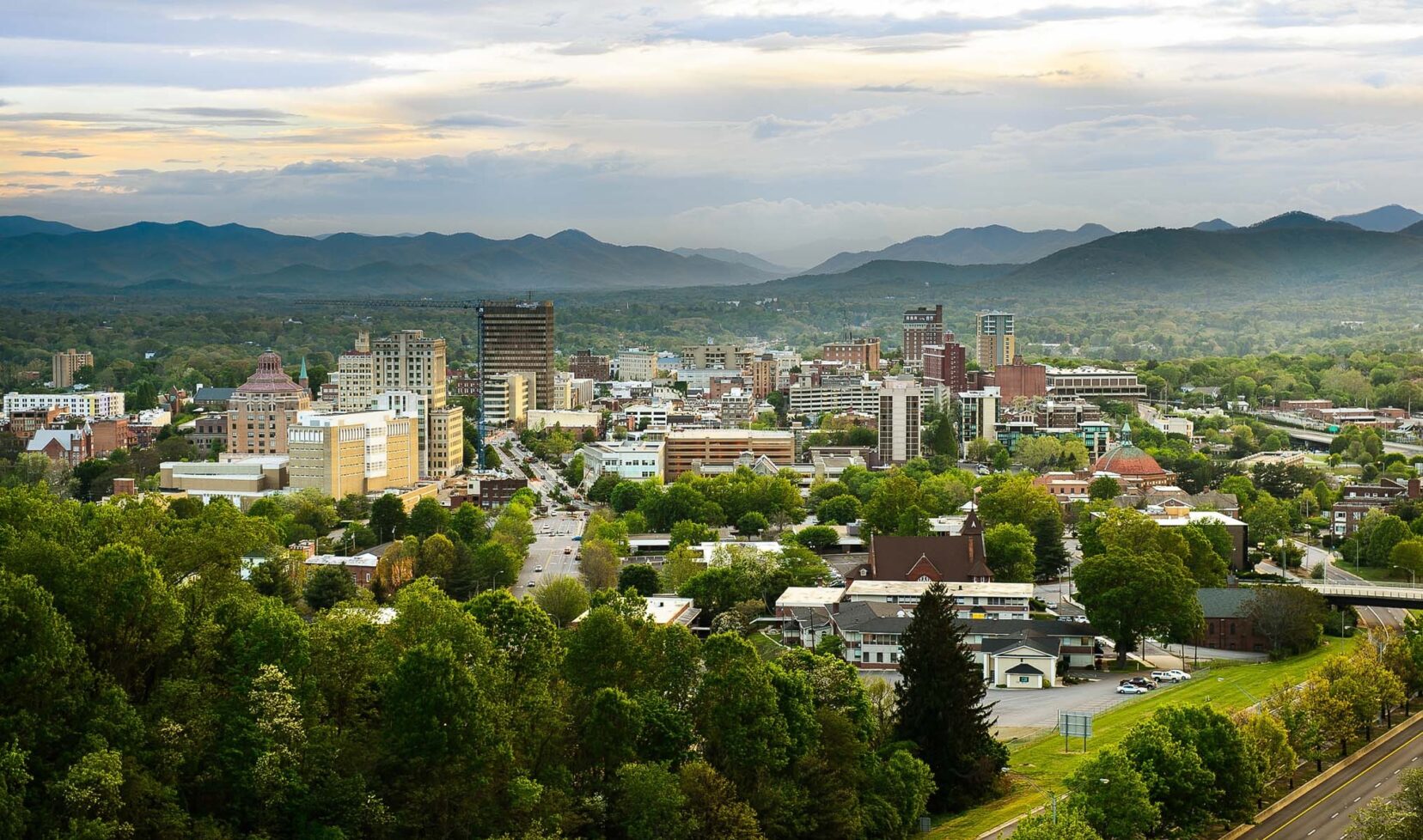 Scenic wide shot of Asheville with The Ramble Biltmore Forest offering a tranquil nature retreat right at the city’s doorstep.