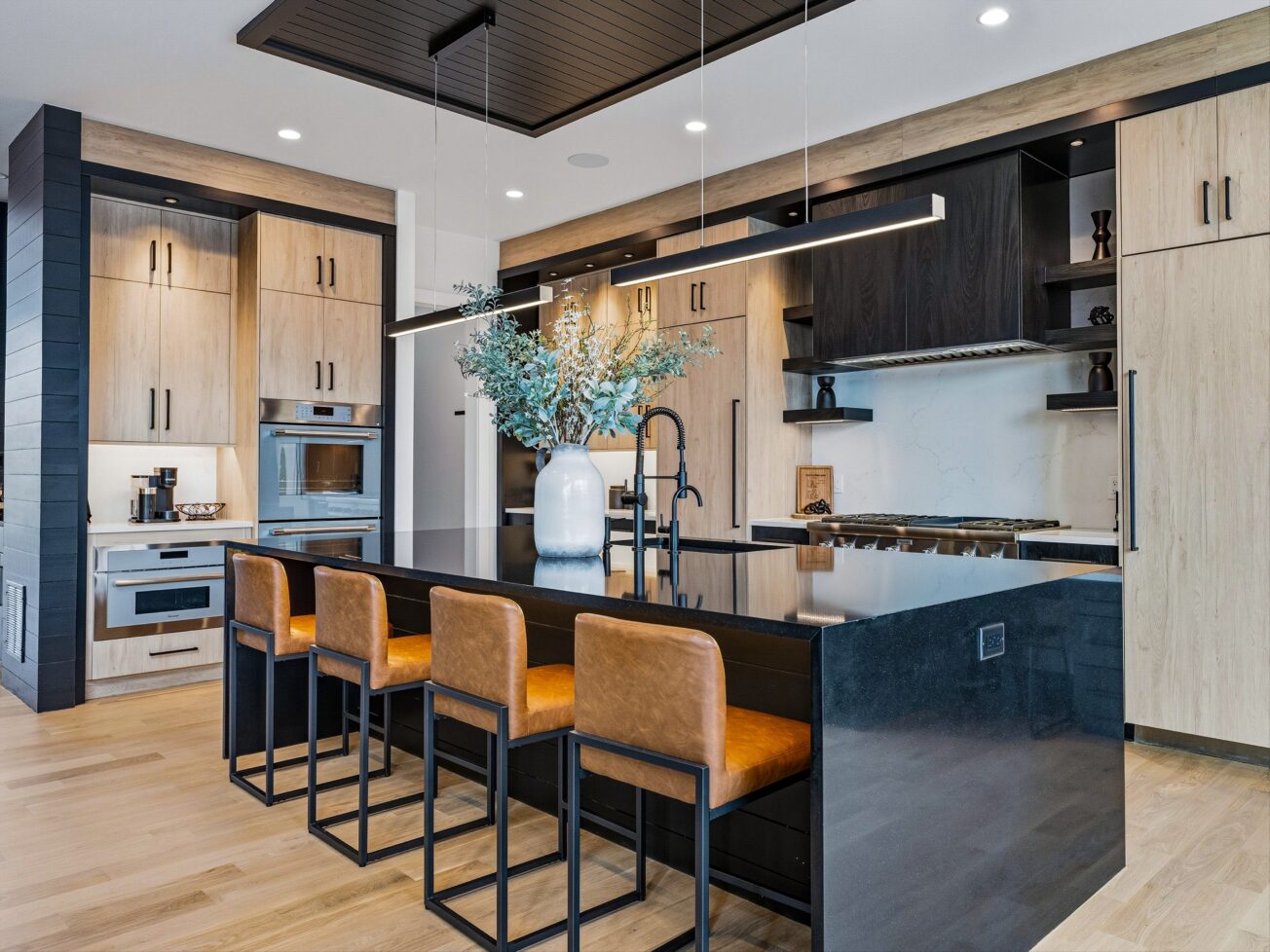 Modern kitchen with black island.